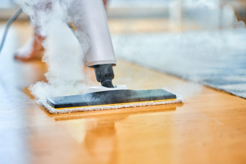Steam cleaner cleaning a floor