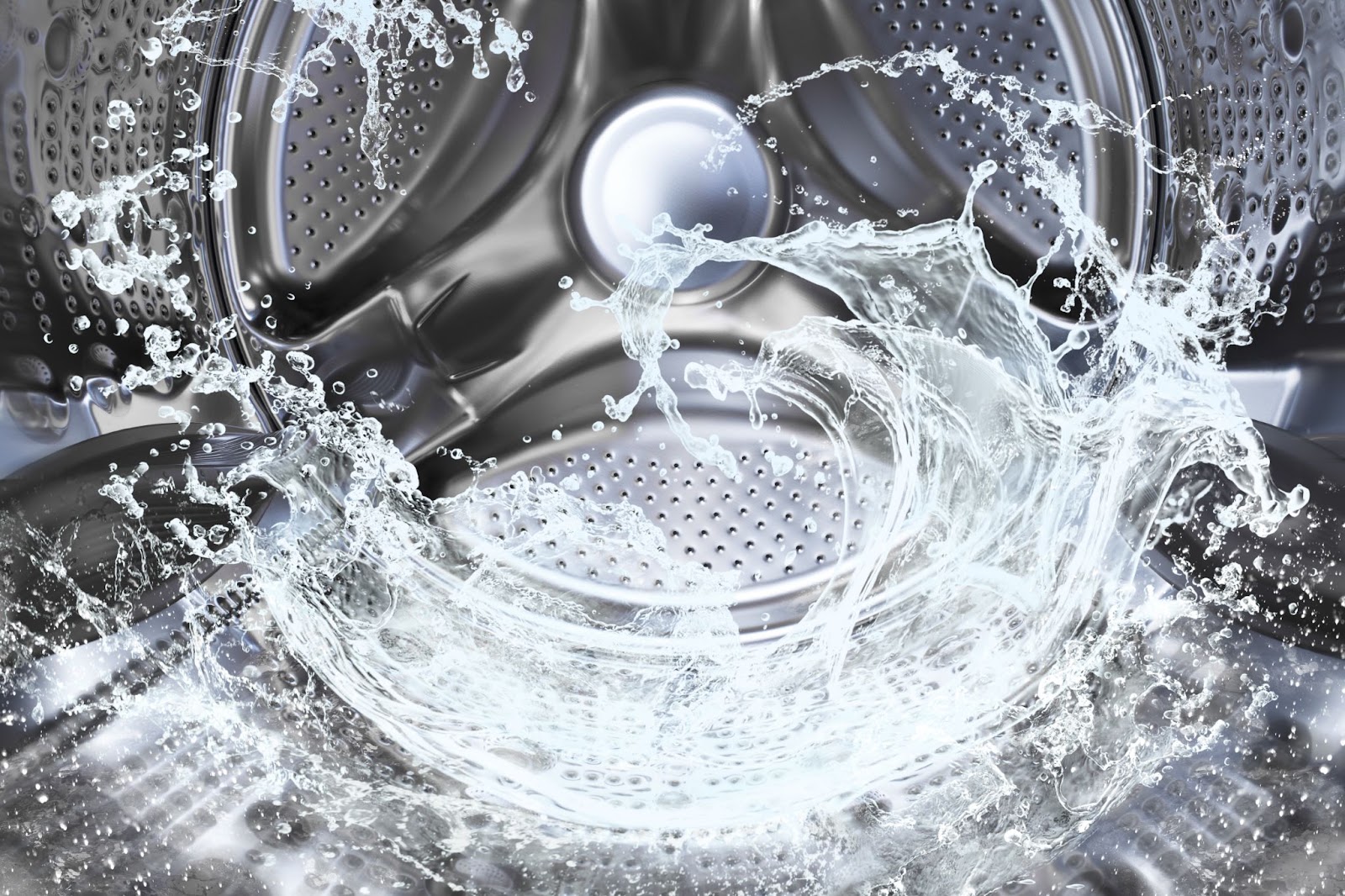Water swirling inside a stainless steel washing machine drum